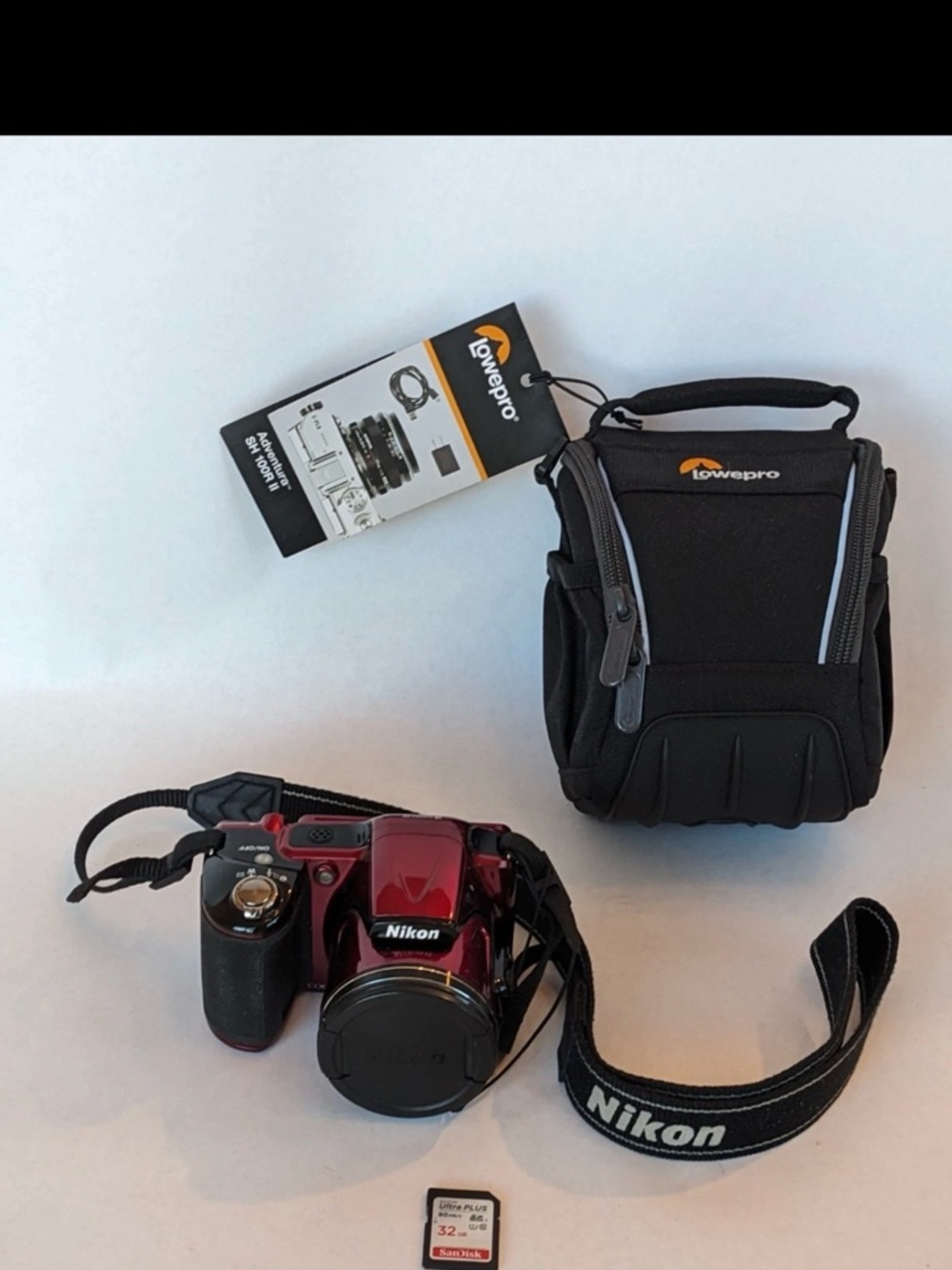 Nikon Red Digital Camera with Black Lowepro Case and Nikon Strap
